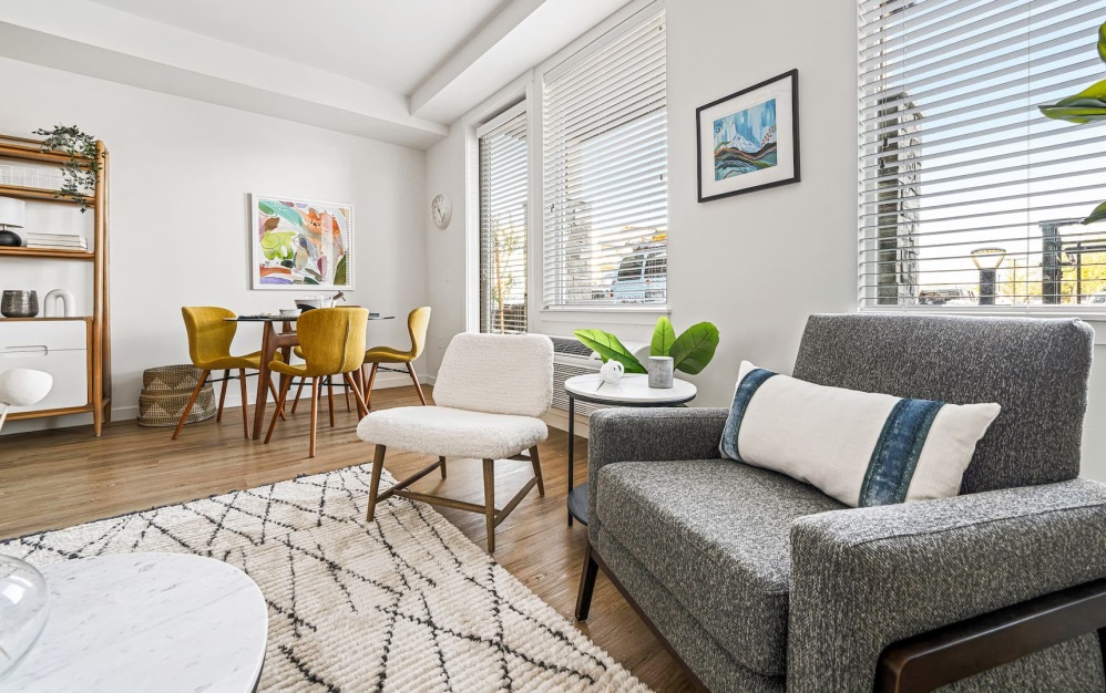 living area that includes ample seating spaces and bright lighting