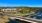 aerial of lake, bridge and nearby neighborhood