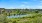 Aerial view of the river with people kayaking in it 