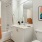 a bathroom with white cabinetry